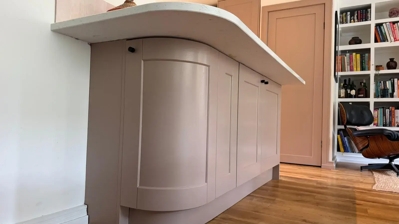 After - Curved island and bookshelf