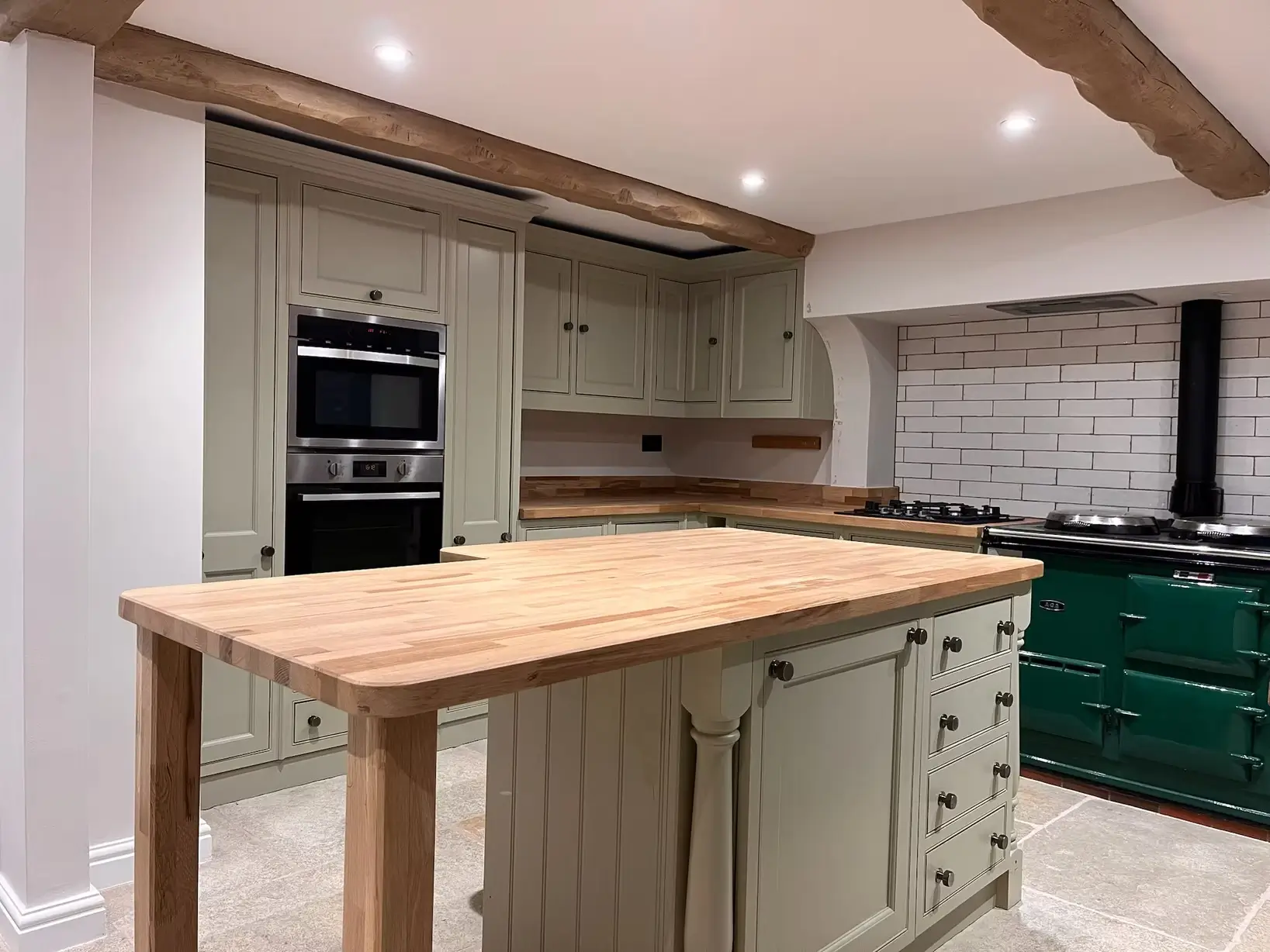 Beautifully resprayed sage green kitchen